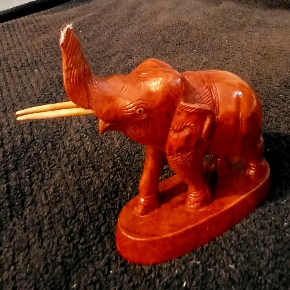 Carved Wood Elephant on Wood Base.